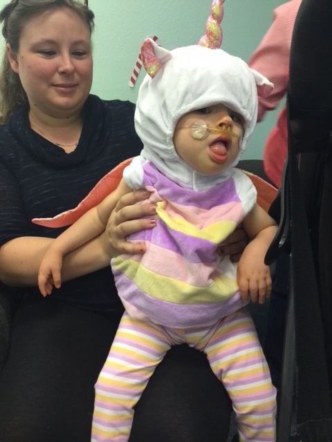 A child dressed as a unicorn.